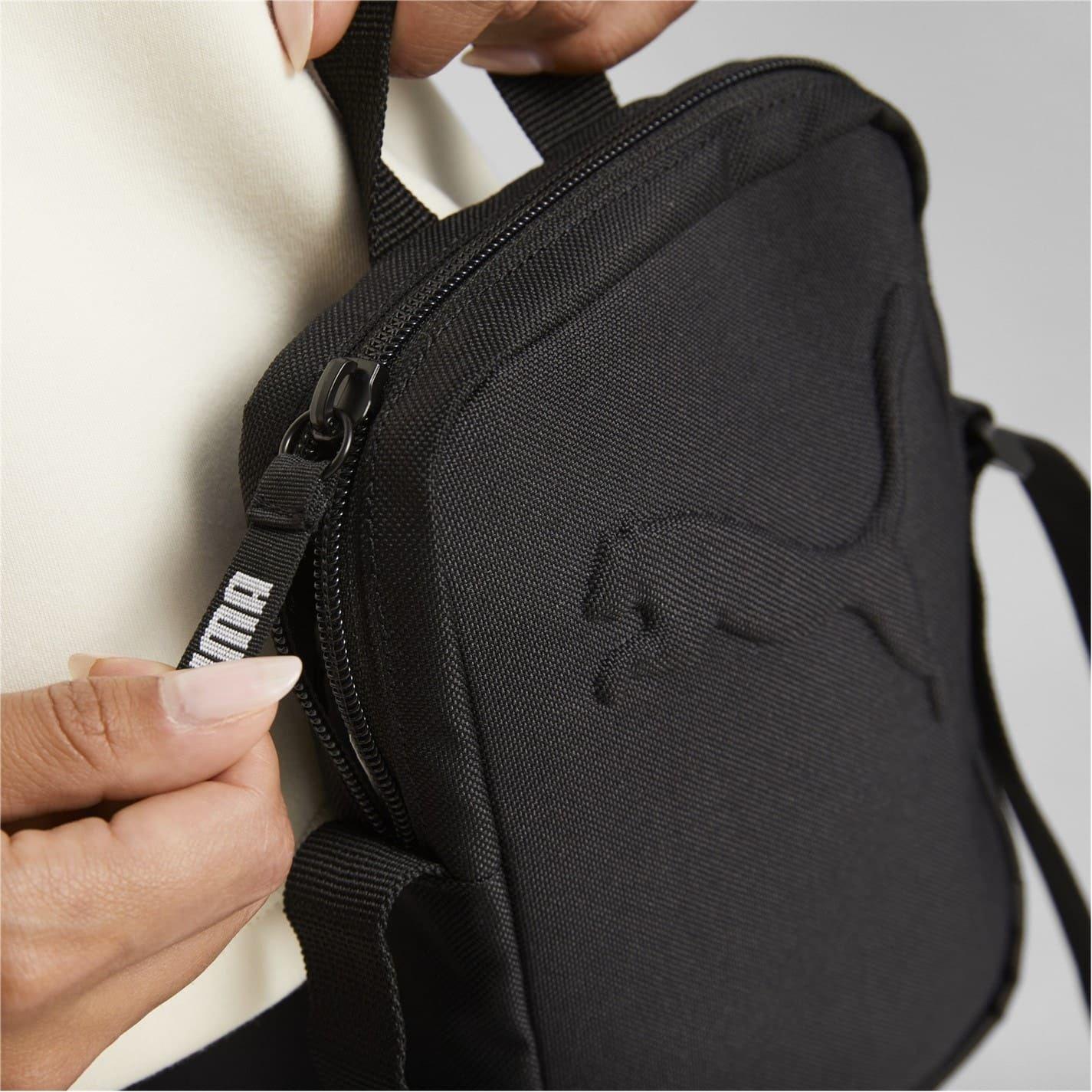 Black - Pack Shot - Puma Buzz Portable Crossbody Bag