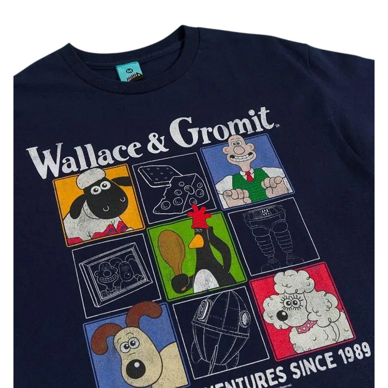 Blue - Side - Wallace and Gromit Unisex Adult Cracking Adventures Since 1989 T-Shirt